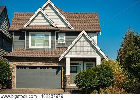 Big Custom Made Luxury House With Nicely Landscaped Front Yard And Long And Wide Driveway To Garage 