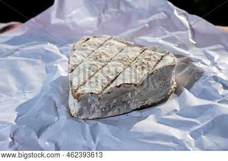 French Heartshaped Neufchatel Cow Cheese On White Paper, Etretat, Normandy, France