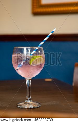 Glass Of Gin And Tonic Cocktail Served In Old Vintage Scottisch Pub, Drinking Gin In Edinburgh, Uk