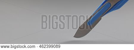 Close-up Of Retractable Pocket Sized Box Cutter Blue Colour Knife, Sharp Equipment. Household Box Cu