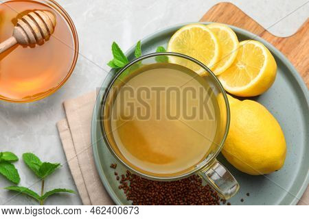 Buckwheat Tea, Lemon And Honey On Light Grey Marble Table, Flat Lay