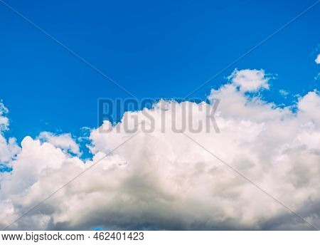 Blue Sky With White Cumulus Clouds Moving Fast In Day Light. Cloudscape. Nature Background. Windy We