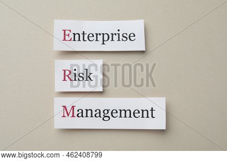 Cards With Abbreviation Erm (enterprise Risk Management) On Beige Background, Flat Lay
