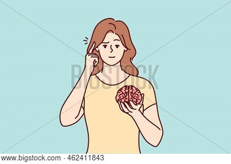 Young Woman Holding Brain Hands Show At Head. Focused Female Ask To Use Brain And Think And Consider