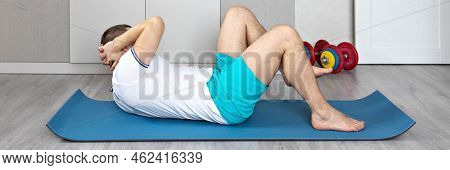 A Strong, Healthy Man With Muscles, Training At Home In The Plank Position. Fitness At Home. Banner.