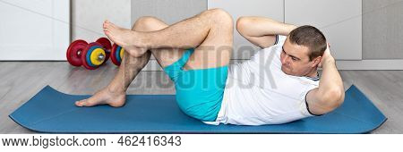 A Strong, Healthy Man With Muscles, Training At Home In The Plank Position. Fitness At Home. Banner.