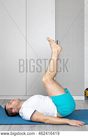 A Strong, Healthy Man With Muscles, Training At Home In The Plank Position. Fitness At Home. Banner.