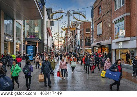 Dublin, November 2019 Henry Street Decorated For Christmas With Crowds Of People On Shopping Spree. 