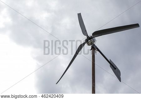 Small Wind Farm On The Roof Of The House. Wind Turbine As An Alternative, Wind Energy Converter, Cle