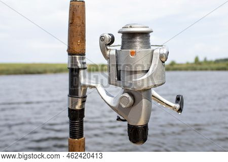 Spinning And Lake. Beach Surfcasting Spinning Fishing Reel And Rod.