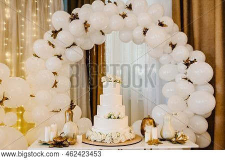 Delicious Wedding Reception. Cake On A Background Balloons. Decorated Table For Wedding. White Ballo