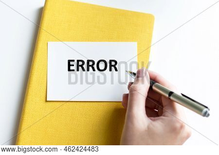 Error Inscription On A White Card Against The Background Of A Yellow Notebook On The Table. Healthca