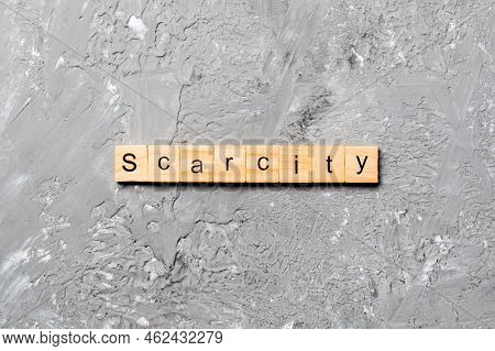 Scarcity Word Written On Wood Block. Scarcity Text On Cement Table For Your Desing, Concept.