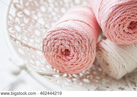 Handmade Macrame Braiding And Cotton Threads In White Basket. Cotton Macrame Cords And Ropes Against
