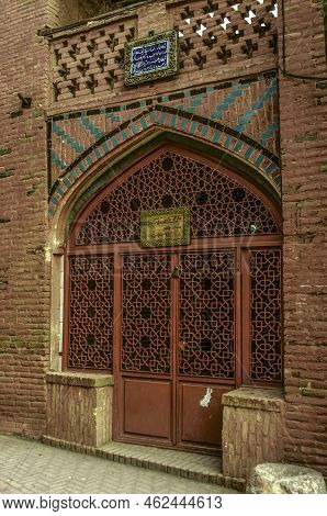 Abyaneh, Iran, Feb 17, 2022: Facade Of The Jamea Mosque Made Of Red Brick With A Beautiful Openwork 