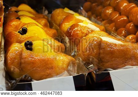 Neapolitan Baba Rum Is A Traditional Italian Sweet. Fluffy Pastry Soaked In Sweet Rum Syrup With Cus
