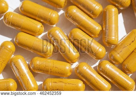 Orange Capsules With Supplements. Turmeric Plus Black Pepper Extract Gelatin Capsule Close Up Top Vi