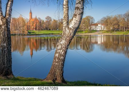 Peaceful City Park And The Church From The Lake Druskonis At Sunrise, Lithuania