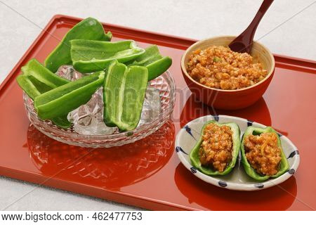 fresh green peppers(chilled in ice water) and Niku Miso (ground pork miso dip), a Japanese tavern appetizer
