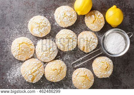 Festive Homemade Cracked Lemon Cookies With Powdered Sugar Close-up On The Table. Horizontal Top Vie