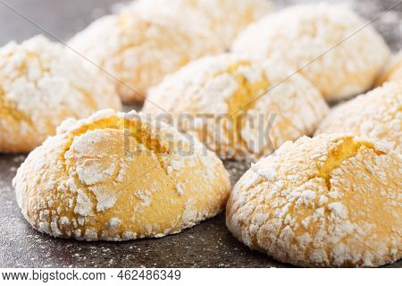 Close-up Of Cracked Lemon Biscuits Sprinkled With Powdered Sugar Close-up On The Table. Horizontal