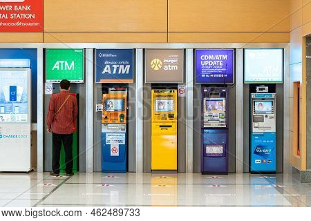Bangkok, Thailand - 14 Aug 2022, A Man Using Kasikorn Atm By Himself Among Many Of Banking Machines 