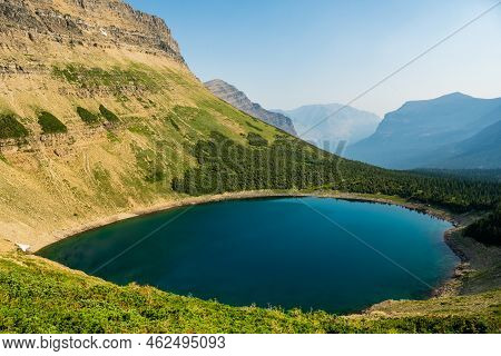 Bright Blue Colors Of Seven Winds Of The Lake High In The Mountains Of Glacier