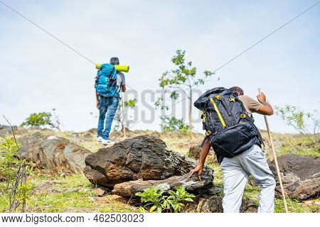 Back View Tracking Shot Of Middle Aged Hikers Climbing Hill Or Mountain - Concept Of Adventure, Leis