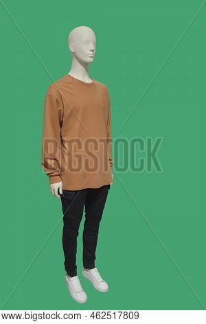 Full Length Image Of A Male Display Mannequin Wearing Brown Collarless Shirt And Black Trousers Isol