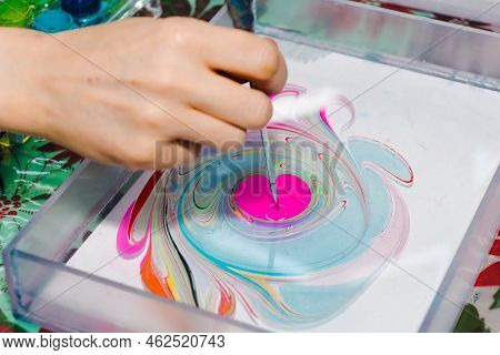 Ebru Painting. Process Of Creating Drawings In Ebru Technique. Drawing With Paints Pattern On Water.