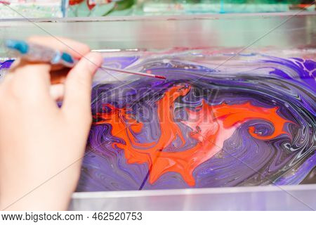 Ebru Painting. Process Of Creating Drawings In Ebru Technique. Drawing With Paints Pattern On Water.