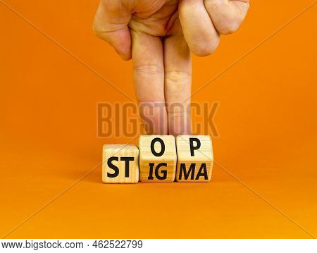 Stop Stigma Symbol. Concept Words Stop Stigma On Wooden Cubes. Businessman Hand. Beautiful Orange Ta