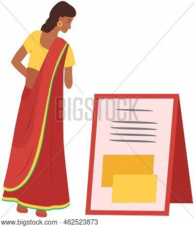Indian Girl In Ethnic Traditional Costume, Sari Stands And Reads Ad. Asian Pretty Woman Reading Anno