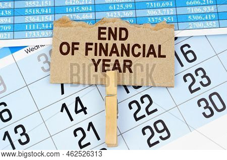 Business Concept. On The Calendar And Reporting Documents Is A Cardboard Plate With The Inscription 