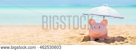 Piggy Bank On Beach With Umbrella. 401k Retire Money