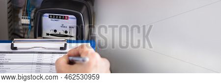 Electricity Counter Metering System. Engineer Reading Meter