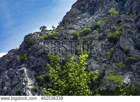 Paklenica, Croatia, Eu - June 25, 2022: Distant View Of Mountain Climbers In National Park Paklenica