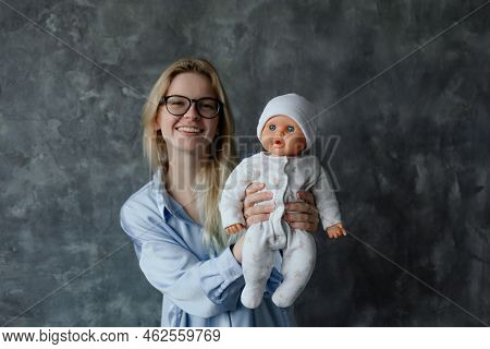 Smiling Future Mother Take Birth Preparation Course, Gray Wall Background, Free Copy Space. Successf