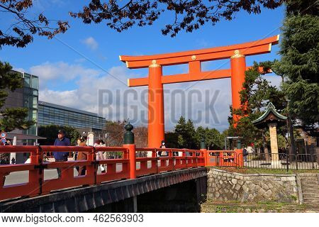Kyoto, Japan - November 24, 2016: People Walk By The Largest Torii Gate In Japan. Kyoto Has 17 Unesc