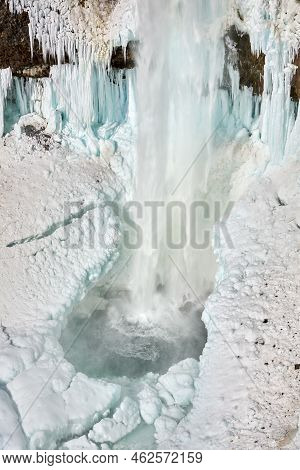 Base Of Frozen Brandywine Falls Whistler. The Pool At The Bottom Of Brandywine Falls In Winter Near 
