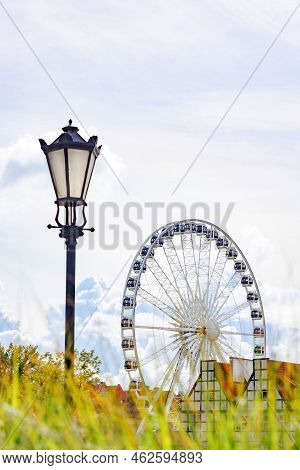 Beautiful Architecture Of The Old City. Gdansk, Poland. European Architecture. Ferris Wheel.