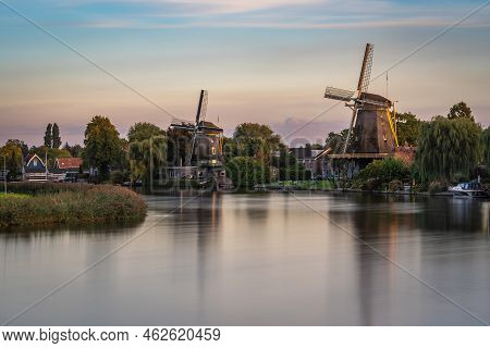 Scenery With Traditional Dutch Windmills Along The River Vecht In The City Of Weesp