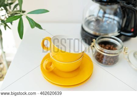 Beautiful Morning, The Process Of Making Coffee. An Automatic Drip Coffee Maker Stands With A Yellow