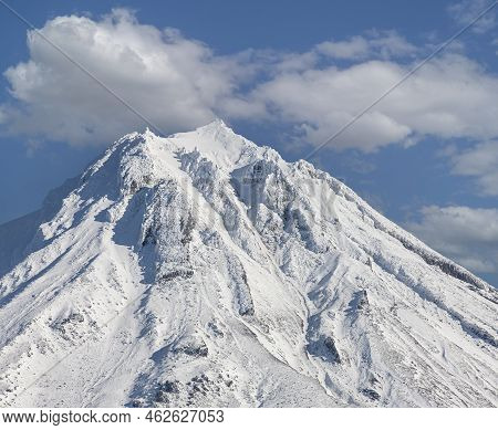 Snowy Peak Of The Vilyuchinsky Volcano On The Kamchatka Peninsula