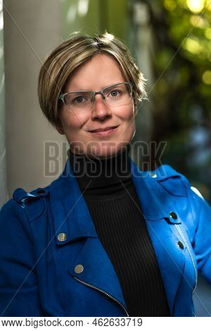 Portrait Of An Attractive Thirty Year Old White Woman Posing In A Narrow Street, Brussels