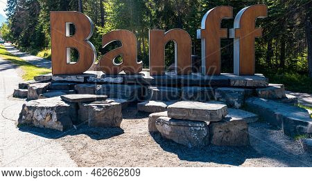 The Banff Sign On Mt Norquay Road Leading Into Banff, Alberta, Canada On A Sunny Summer Day