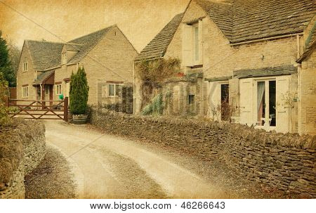 Bibury - landsby i Gloucestershire, England, UK. Foto i retro-stil. Papir tekstur.