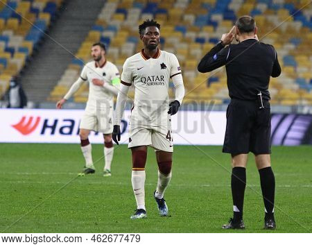 Kyiv, Ukraine - March 18, 2021: Player Amadou Diawara Of Roma Talks To Referee Antonio Mateu Lahoz (