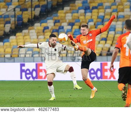 Kyiv, Ukraine - March 18, 2021: Carles Perez Of Roma (l) Fights For A Ball With Mykola Matviyenko Of