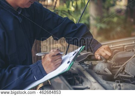 Mechanic Car Service Auto Garage In Automotive Mobile Center. Technician Workshop Repair Engine Moto